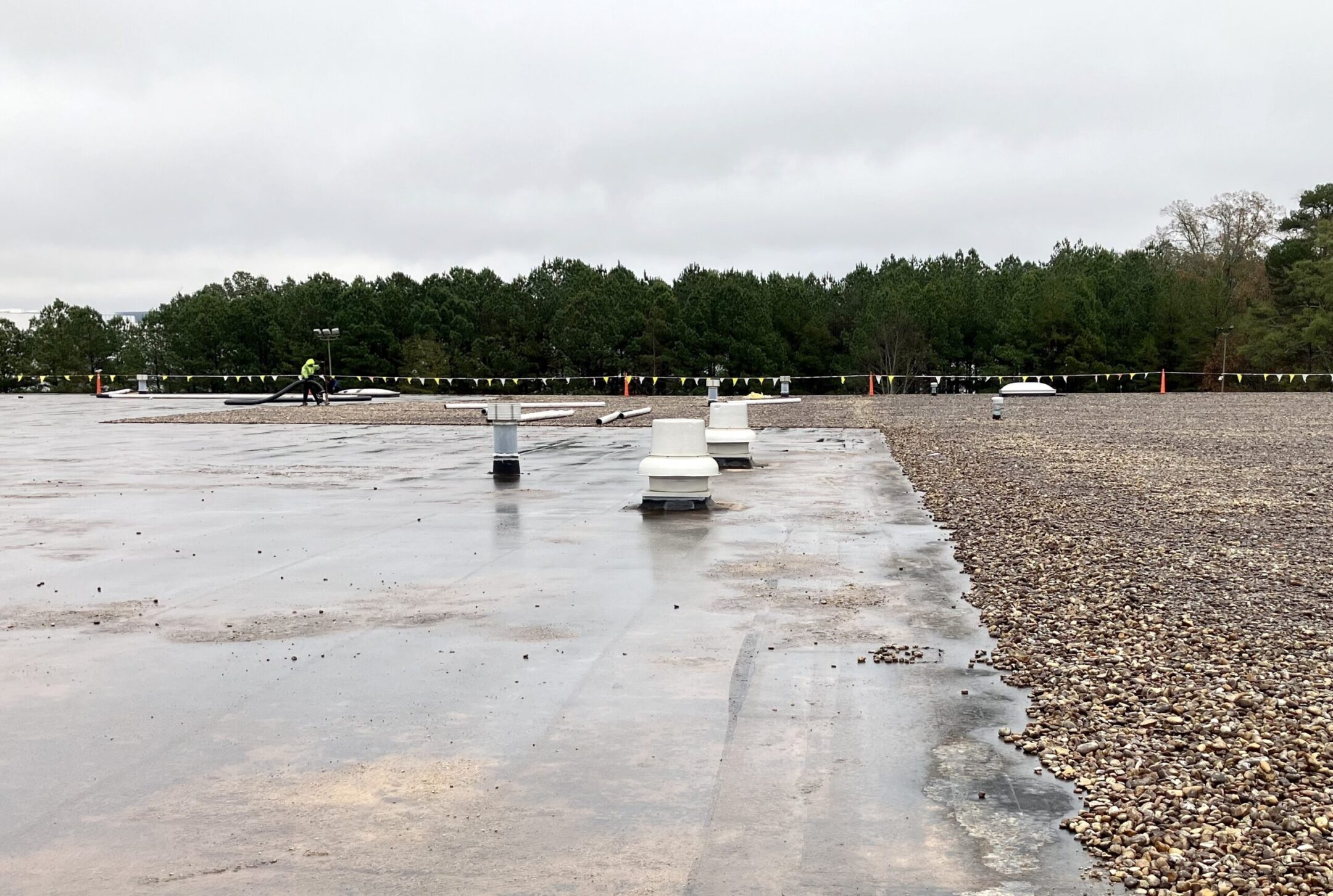 ballast roof with rock being removed and vents