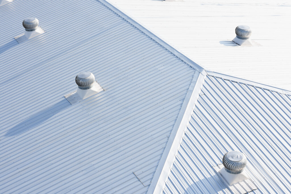 metal sheet roofing on commercial construction with blue sky