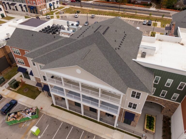 aerial view of shingle roof on apartment building