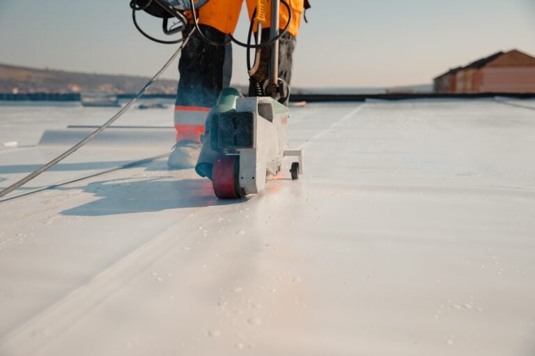 Waterproofing and insulation at construction site, waterproofing membrane preventing water penetration.