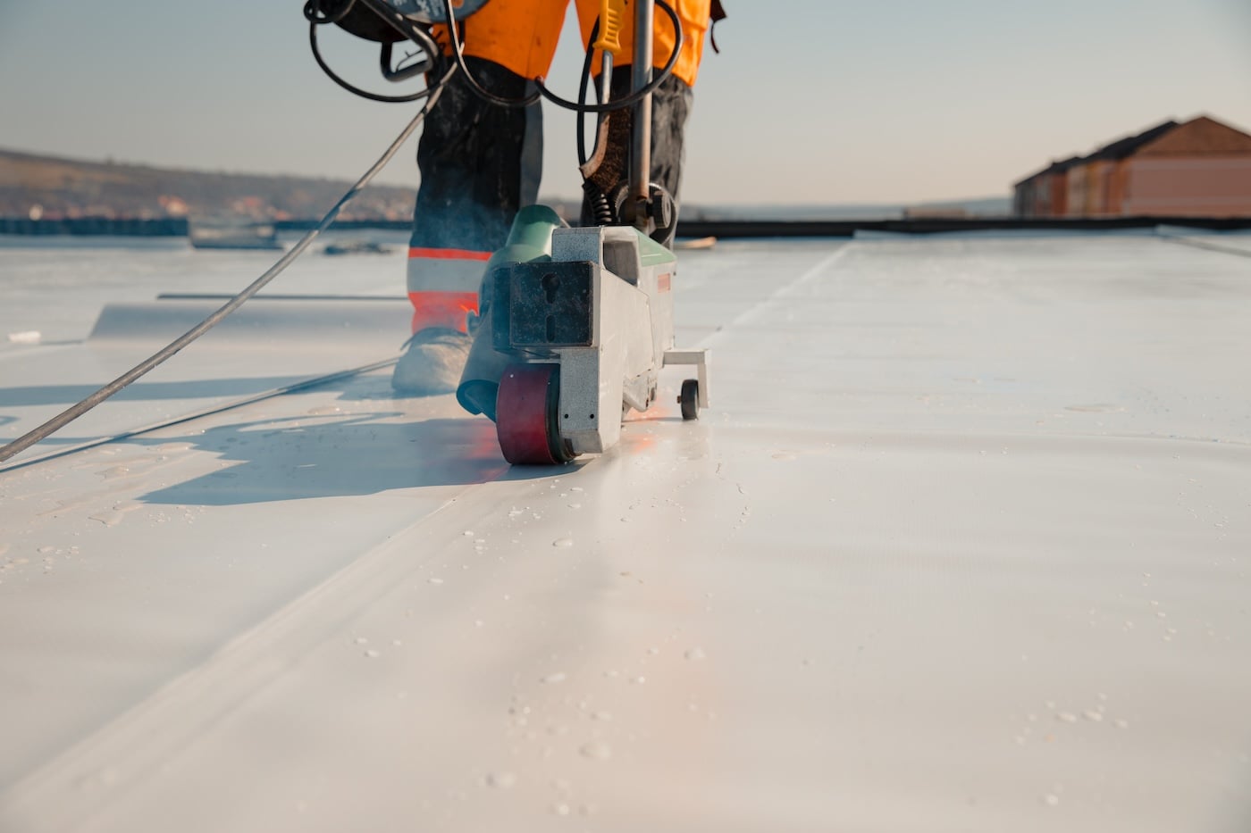 Waterproofing and insulation at construction site, waterproofing membrane preventing water penetration.