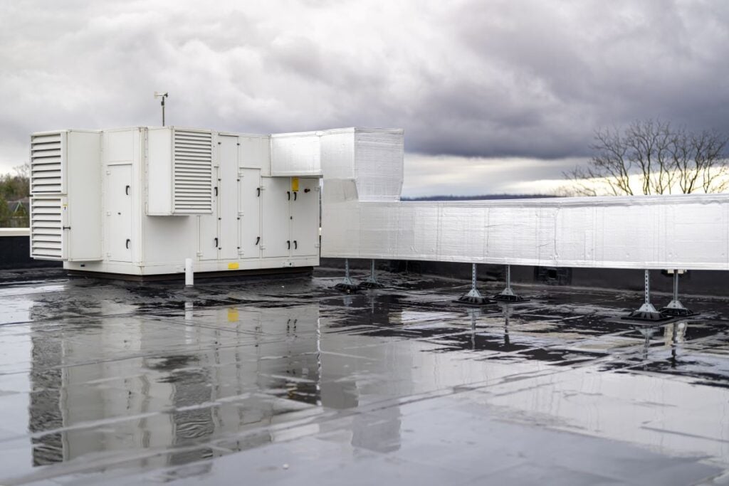 Photo of a roof top unit, RTU, on a new EPDM on a large commercial building