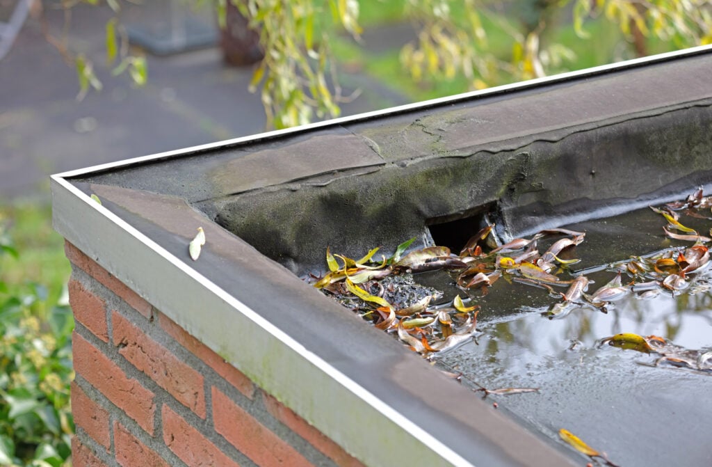 Water drainage on a flat roof, selective focus