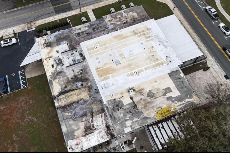 white commercial roof damaged